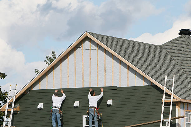 Professional Siding technician working in Madison, PA
